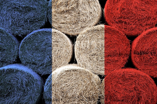 France flag on the surface of a stack of hay rolls