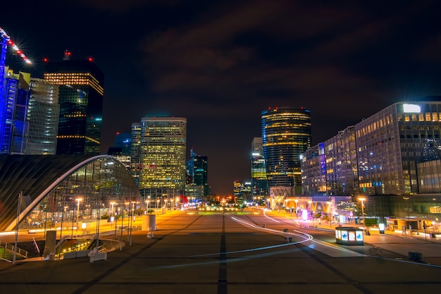 France. Paris. Night district La Defense. Large pedestrian square surrounded by modern skyscrapers