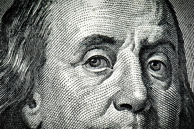 Photo franklin eyes from money dollars as a texture