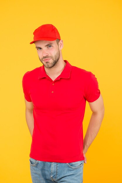 Photo free cashier. first job. guy cashier uniform. restaurant cafe staff wanted. man delivery service yellow background. have nice day. friendly sale assistant. food order deliveryman. regular cashier.