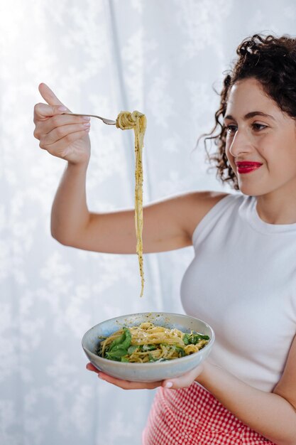 Free photo chef holding raw pasta