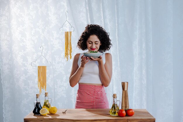 Free photo chef holding raw pasta