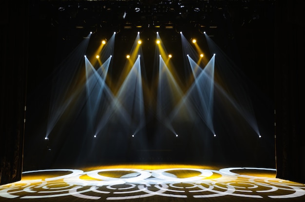 Free stage with lights, lighting devices. Night show.