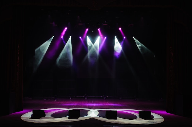 Free stage with lights, lighting devices. Night show.