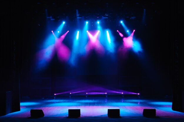 Free stage with lights, lighting devices. Night show.