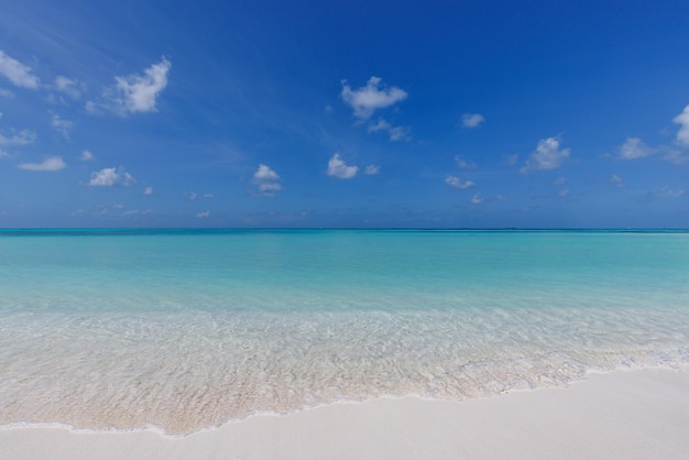 Freedom beach. Closeup white sand, calm blue sea, sunny sky. Seascape horizon. Beautiful outdoors