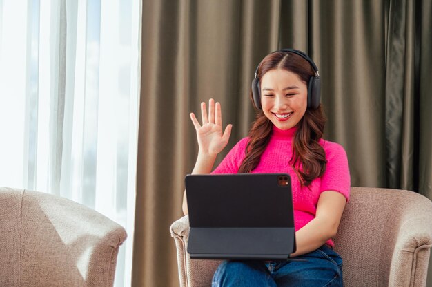 Freelance asian woman talking on video call