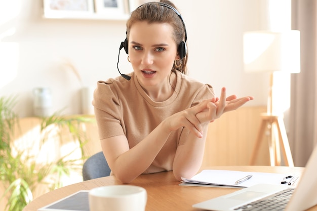 freelance business women using tablet working call video conference with customer in workplace at home.
