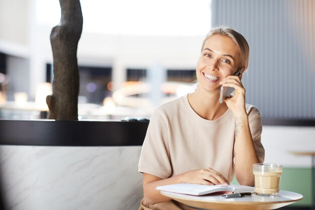 Freelance telemarketer talking on phone