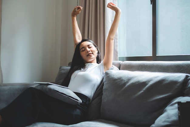 Freelance woman working in business by using laptop computer on a bed at home young girl lifestyle