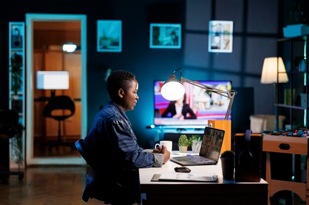 Freelancer attends video call on laptop