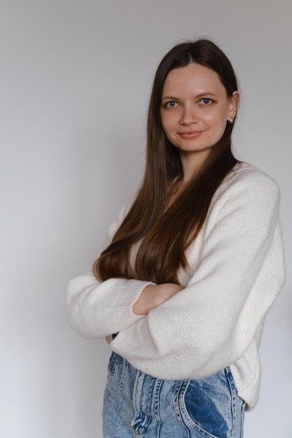 Freelancer business portrait woman in her 20s over white wall