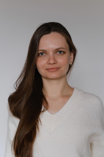 Freelancer business portrait woman in her 20s over white wall