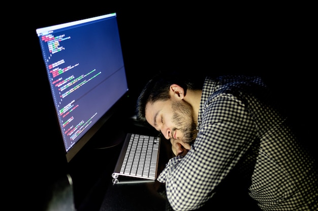 Freelancer programmer falling his face down taking a nap