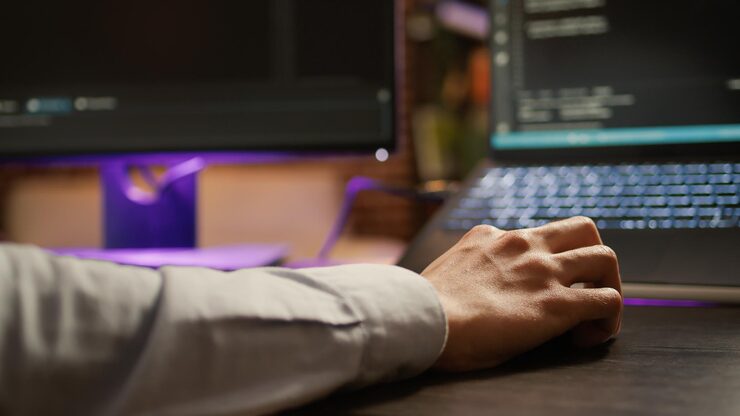 Photo freelancer programming binary code on software server, coding encryption system with firewall application. hacking security program on network script for development. close up. .