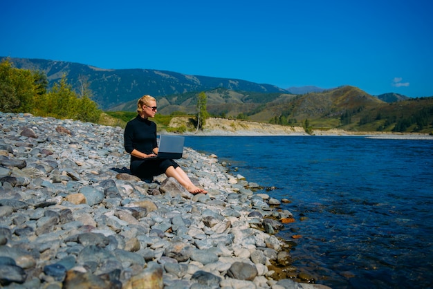 Freelancer with laptop on the nature