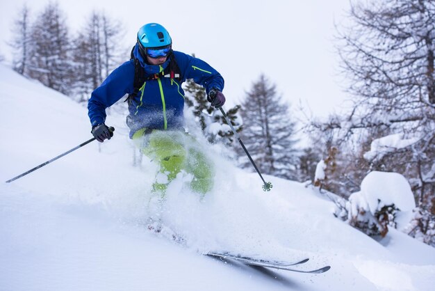 freeride skier skiing downhill