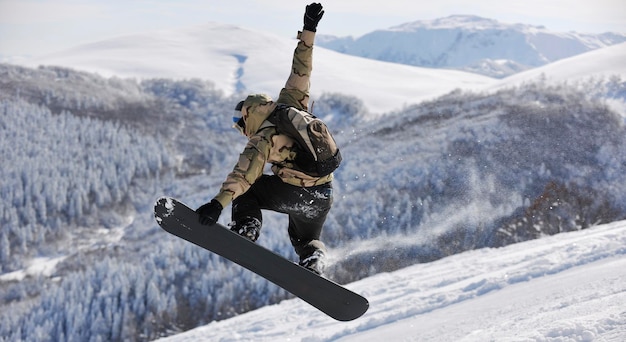 Freestyle snowboarder jump and ride