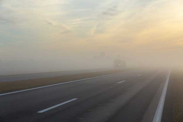 Freeway and a car in fog