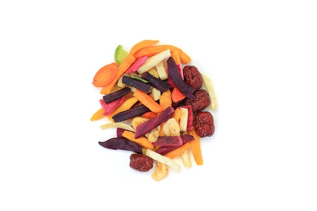 Freeze dried colorful crispy fruits and vegetables over white background. Mixed dry food for health. Top view