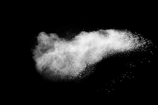 Freeze motion explosion of white powder on  black background.