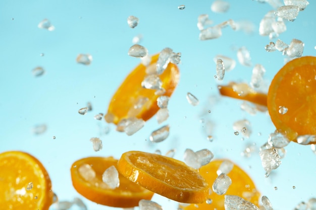 Freeze Motion of flying orange slices with ice