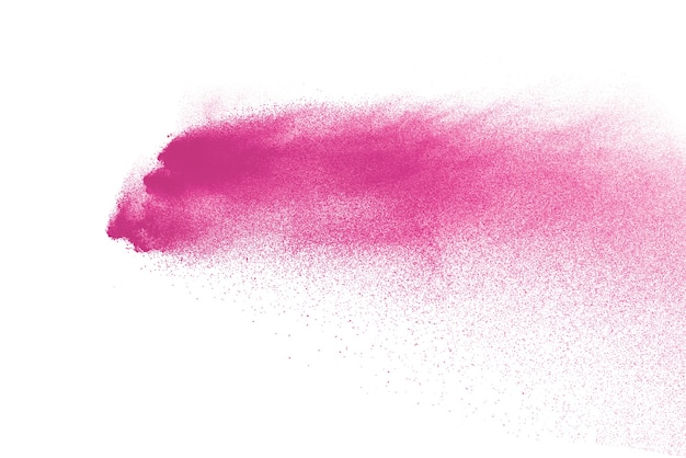 Foto blocca il movimento della polvere di colore rosa che esplode su bianco