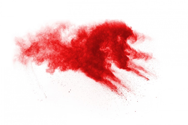 Freeze motion of red powder exploding, isolated on white background. 