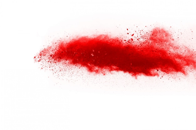 Freeze motion of red powder exploding, isolated on white background.  