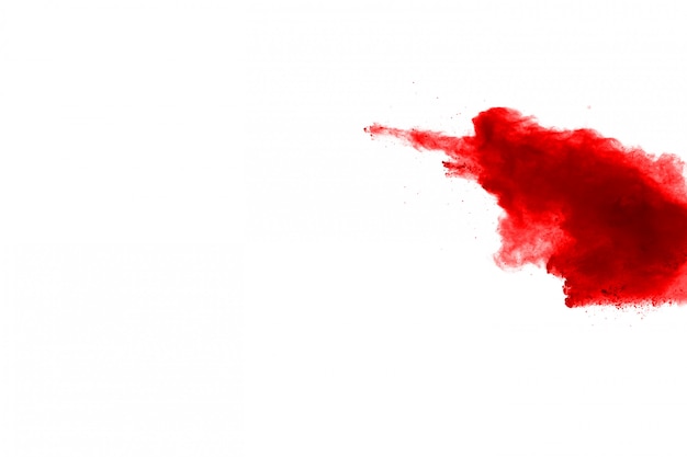 Freeze motion of red powder exploding, isolated on white background. 