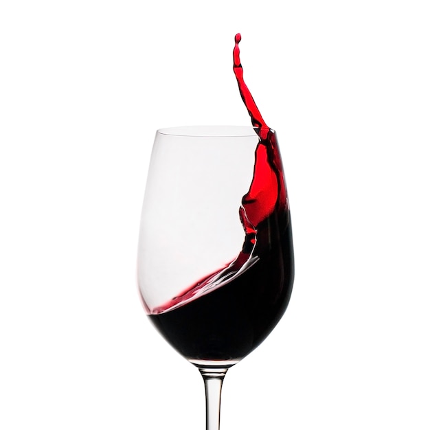 Foto bloccare il movimento di spruzzi di vino rosso in un bicchiere