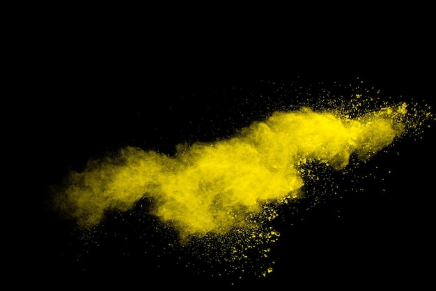 Freeze motion of yellow orange dust particles splash