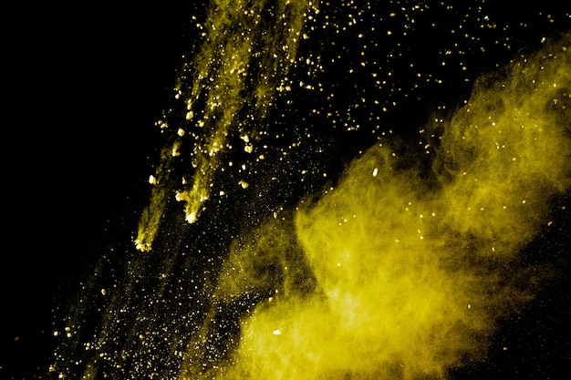 Freeze motion of yellow powder splash.