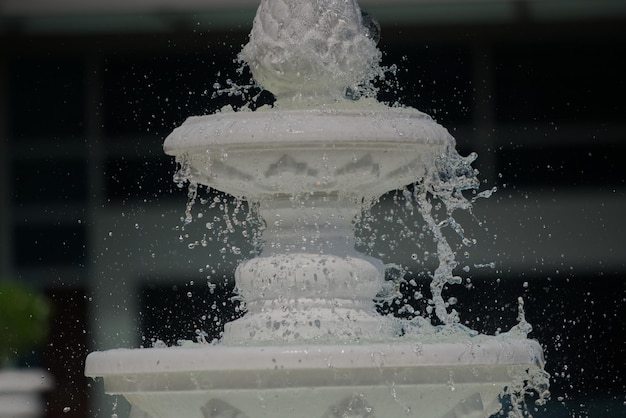 Photo freezing water droplet from a retro artificial fountain