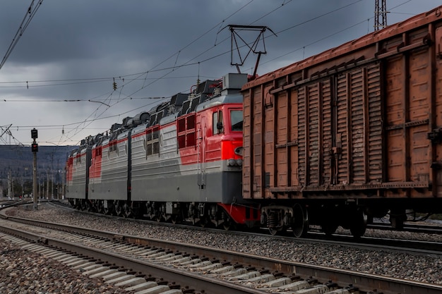 The freight train moves quickly through the countryside Transportation of goods by rail