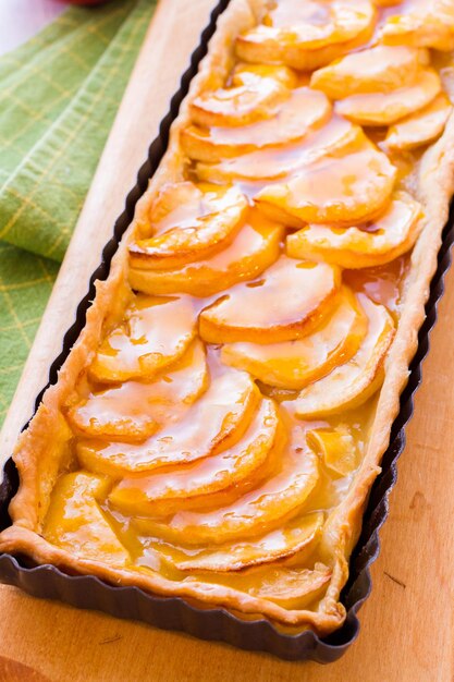 French apple tart made with red apples and apricot glaze.