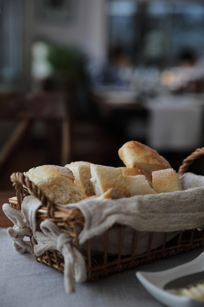 French bread baguettes in wood basket the wooden background