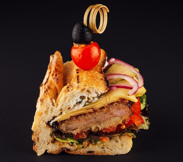 French bread sandwich on black background