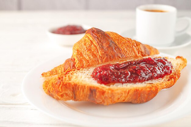 Photo french breakfast delicious fresh croissants with jam and a cup of coffee