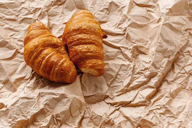 French croissants on craft crumpled paper