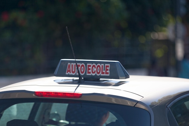 French driving school sign