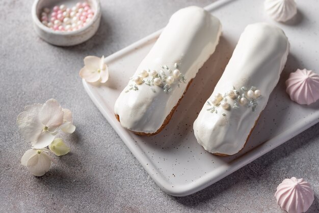 French eclairs with white chocolate topping