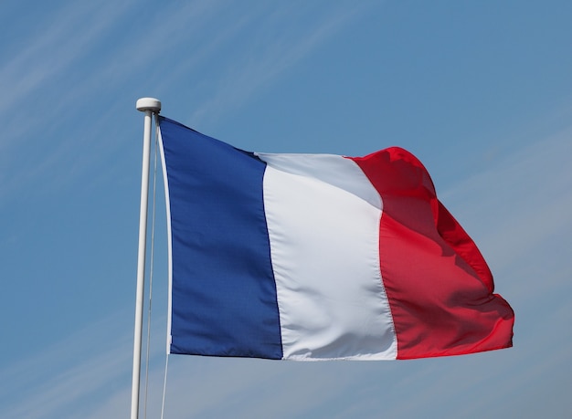 French Flag of France over blue sky