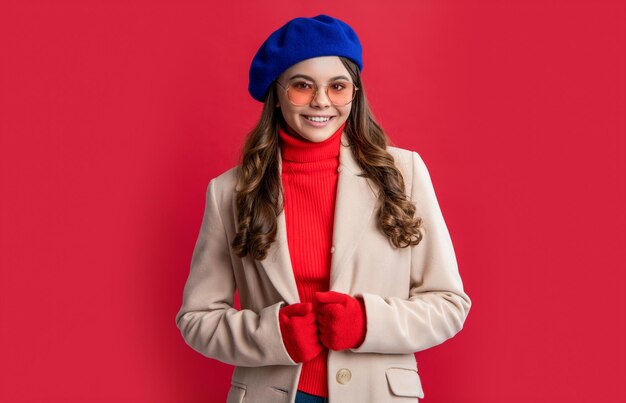 french french teen girl in studio young french teen girl photo of teen girl with brunette hair french teen girl isolated on red background