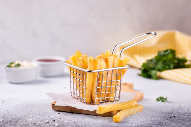 French fries in a basket on modern