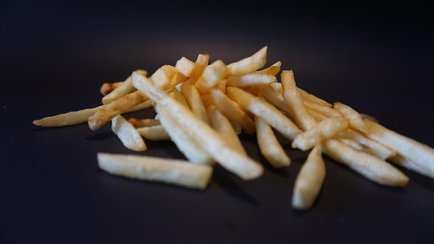 French fries on a black background