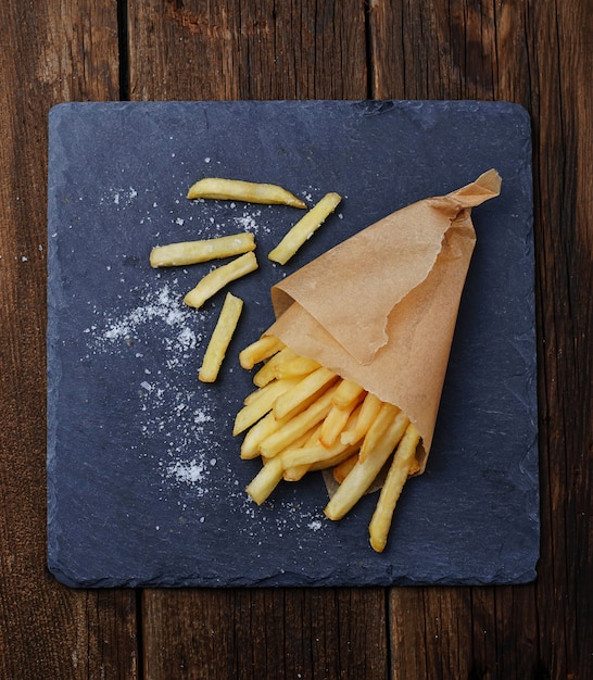 French fries in paper wrapper