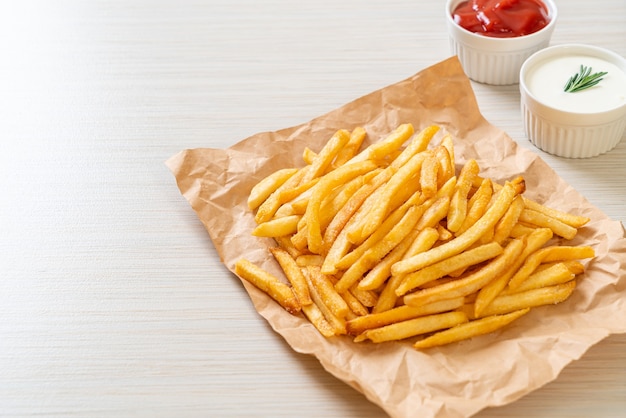 French fries or potato chips with sour cream and ketchup