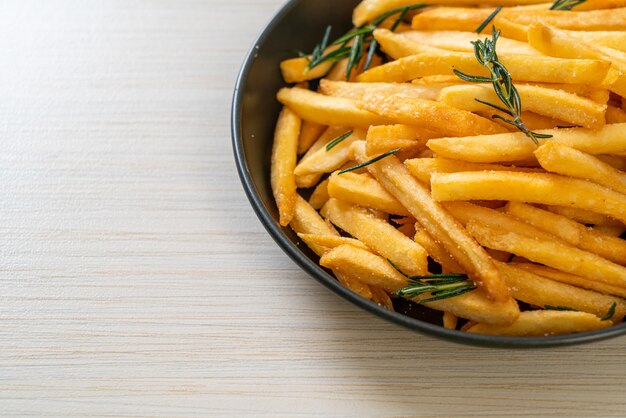 French fries or potato chips with sour cream and ketchup