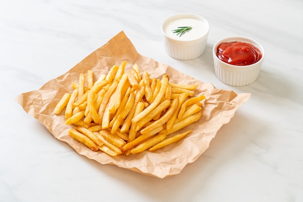 French fries or potato chips with sour cream and ketchup